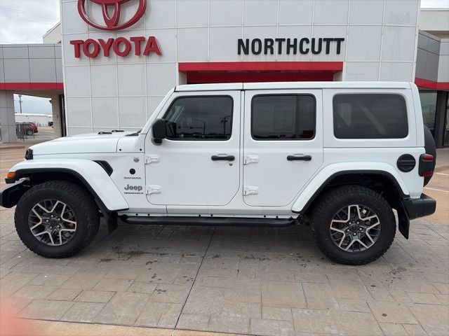 2024 Jeep Wrangler Sahara in White — front three-quarter view