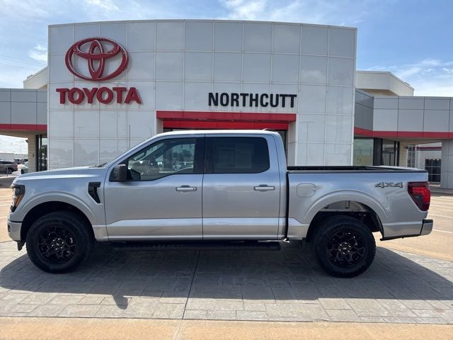 2025 Ford F-150 XLT in Iconic Silver M — front three-quarter view